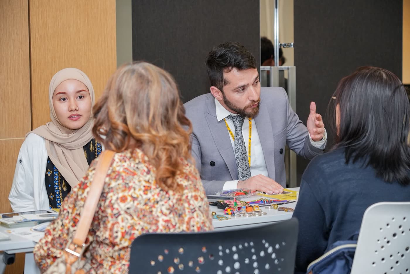 Arif Hussain presenting to a table of buyers