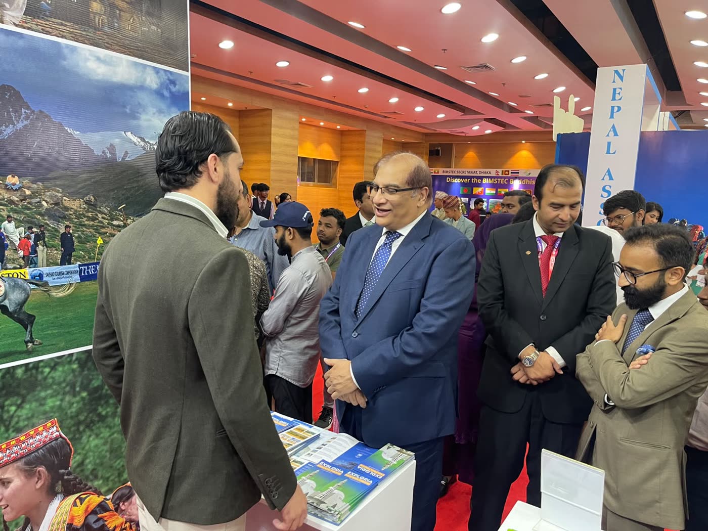Arif Hussain with the High Commissioner of Pakistan to Bangladesh, H.E. Mr. Imran Haider, and diplomats at the Pakistan stand